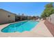 Backyard pool and patio area with lounge chairs surrounded by desert landscaping at 1744 E Huber St, Mesa, AZ 85203