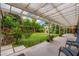 Inviting covered patio overlooking a lush backyard with garden and detached bonus room at 2219 W Catalina Dr, Phoenix, AZ 85015