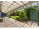 Covered patio overlooking a lush yard with shed and beautiful landscaping at 2219 W Catalina Dr, Phoenix, AZ 85015