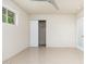 Bright bedroom featuring neutral walls, tile flooring, a ceiling fan, and a window at 2219 W Catalina Dr, Phoenix, AZ 85015