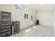 Bonus room featuring patterned floors, several windows, and utility shelving at 2219 W Catalina Dr, Phoenix, AZ 85015