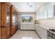 Bright kitchen with custom cabinets, sleek countertops, and stainless steel appliances at 2219 W Catalina Dr, Phoenix, AZ 85015