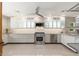 A sleek modern kitchen with stainless steel appliances and bright countertops at 2219 W Catalina Dr, Phoenix, AZ 85015