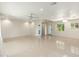 Spacious living room featuring sleek tiled floor, modern lighting and neutral color palette at 2219 W Catalina Dr, Phoenix, AZ 85015