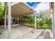 Exterior shot of a covered patio leading to a lush garden at 2219 W Catalina Dr, Phoenix, AZ 85015
