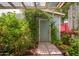 Landscaped shed with climbing vines, stone pathway and unique white globe outdoor lighting at 2219 W Catalina Dr, Phoenix, AZ 85015