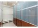 Walk-in closet with custom shelving, hanging rods, and ample storage space at 2219 W Catalina Dr, Phoenix, AZ 85015