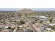 Scenic aerial view of residential area with well-maintained streets, parks, and mountains in background at 2346 E Sylvia St, Phoenix, AZ 85022