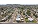 Expansive aerial view of a neighborhood with mature trees and mountain views in the distance at 2346 E Sylvia St, Phoenix, AZ 85022