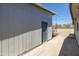 Backyard patio shows painted detached garage and access to brick patio at 2346 E Sylvia St, Phoenix, AZ 85022