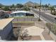 Aerial view of the fenced backyard featuring a mature tree, large patio area, and outdoor potential at 2346 E Sylvia St, Phoenix, AZ 85022