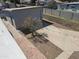 A serene backyard featuring a mature tree and expansive concrete patio at 2346 E Sylvia St, Phoenix, AZ 85022