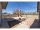Backyard with patio, desert landscaping, privacy fence, and string lights, ideal for outdoor gatherings at 2346 E Sylvia St, Phoenix, AZ 85022