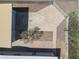Aerial view of the backyard with a mature tree, a concrete patio, and a storage shed at 2346 E Sylvia St, Phoenix, AZ 85022