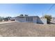 Front view of a gray stucco house featuring a low maintenance yard at 2346 E Sylvia St, Phoenix, AZ 85022
