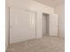 Bedroom with neutral carpet, white walls, a closet with sliding doors, and a doorway at 44188 W Cydnee Dr, Maricopa, AZ 85138