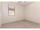 Bedroom featuring neutral carpet flooring, white walls, and a window at 44188 W Cydnee Dr, Maricopa, AZ 85138