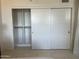 A bright white closet with sliding doors and shelving for ample storage at 535 W Thomas Rd # 407, Phoenix, AZ 85013