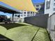 Exterior shot of the apartment community dog park with artificial turf and shade at 535 W Thomas Rd # 407, Phoenix, AZ 85013