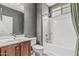 Cozy bathroom featuring a shower-tub combo and spacious single sink vanity at 10945 E Storia Ave, Mesa, AZ 85212