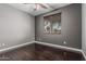 Calm bedroom with new laminate flooring and natural light from the outside window at 10945 E Storia Ave, Mesa, AZ 85212