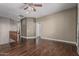Expansive bonus room with hardwood flooring, providing endless possibilities for customization at 10945 E Storia Ave, Mesa, AZ 85212