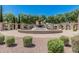 Attractive community fountain surrounded by lush greenery, perfect for a relaxing outdoor space at 10945 E Storia Ave, Mesa, AZ 85212