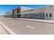 Exterior view of the Gateway Polytechnic Academy; modern architecture and ample parking at 10945 E Storia Ave, Mesa, AZ 85212