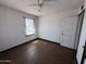 Simple bedroom with hard surface floor and a window at 112 S 28Th Dr, Phoenix, AZ 85009