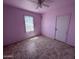 Bedroom featuring linoleum flooring, neutral walls, a window and a closet door at 112 S 28Th Dr, Phoenix, AZ 85009