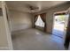 Empty living room featuring a ceiling fan, and a view to the outside at 112 S 28Th Dr, Phoenix, AZ 85009