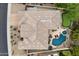 Aerial shot showcasing a private backyard oasis with pool, spa, putting green, and desert landscape at 11448 E Blue Sky Dr, Scottsdale, AZ 85262