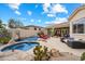 Backyard oasis features a pool, spa, patio, and desert plants for outdoor living and entertaining at 11448 E Blue Sky Dr, Scottsdale, AZ 85262