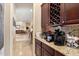 Butler's pantry boasting granite countertops and a convenient wine rack at 11448 E Blue Sky Dr, Scottsdale, AZ 85262