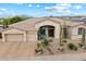 Beautiful single-story home with desert landscaping, three-car garage, and charming curb appeal at 11448 E Blue Sky Dr, Scottsdale, AZ 85262