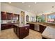 Spacious kitchen showcases rich cabinetry, granite countertops, stainless steel appliances, and center island at 11448 E Blue Sky Dr, Scottsdale, AZ 85262