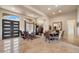 Bright open-concept living and dining area with tile floors at 11448 E Blue Sky Dr, Scottsdale, AZ 85262