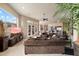 Spacious living room with comfortable seating, large windows, and easy access to the kitchen and outdoor areas at 11448 E Blue Sky Dr, Scottsdale, AZ 85262