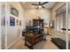 Home office featuring built-in shelving, a ceiling fan, and ample workspace at 11448 E Blue Sky Dr, Scottsdale, AZ 85262