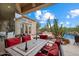 Outdoor patio featuring cozy seating, a dining area and desert landscape for entertaining at 11448 E Blue Sky Dr, Scottsdale, AZ 85262