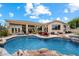 Stunning pool area featuring a hot tub, patio seating and native landscaping at 11448 E Blue Sky Dr, Scottsdale, AZ 85262