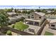 Aerial view of home with a landscaped yard, balcony, and desert landscaping at 119 S Monterey St, Gilbert, AZ 85233