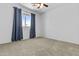 This bedroom has plush carpet, a window with curtains, and neutral paint at 119 S Monterey St, Gilbert, AZ 85233