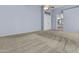 Bedroom view includes soft blue walls, neutral carpeting, and bathroom and closet entrances at 119 S Monterey St, Gilbert, AZ 85233