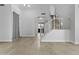 View of the home's entryway featuring tile floors and staircase to the second floor at 119 S Monterey St, Gilbert, AZ 85233