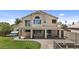 Spacious home features a balcony, covered patio, landscaped yard, and paved walkway at 119 S Monterey St, Gilbert, AZ 85233