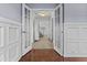 Hallway leading into the home showing hardwood floors and traditional millwork at 119 S Monterey St, Gilbert, AZ 85233