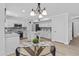 Kitchen featuring granite countertops, stainless steel appliances, a breakfast nook and an island at 119 S Monterey St, Gilbert, AZ 85233