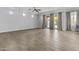 Bright living area featuring tile floors, neutral paint, recessed lighting, and sliding glass doors to the backyard at 119 S Monterey St, Gilbert, AZ 85233