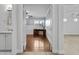 View of the home office with hardwood floors, traditional wainscoting, and a built-in desk at 119 S Monterey St, Gilbert, AZ 85233